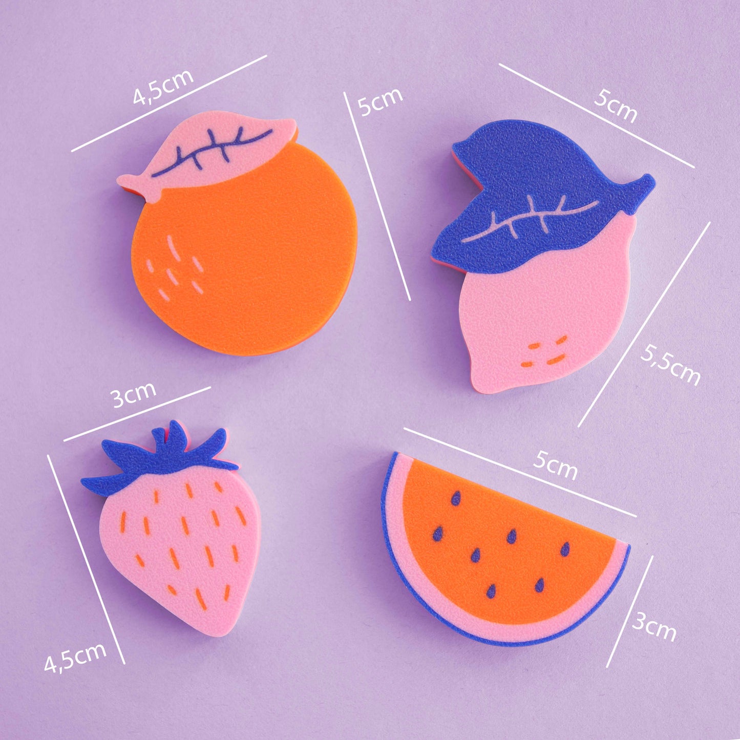 colorful 3D-printed magnets in the shape of fruit: orange, strawberry, lemon and melon