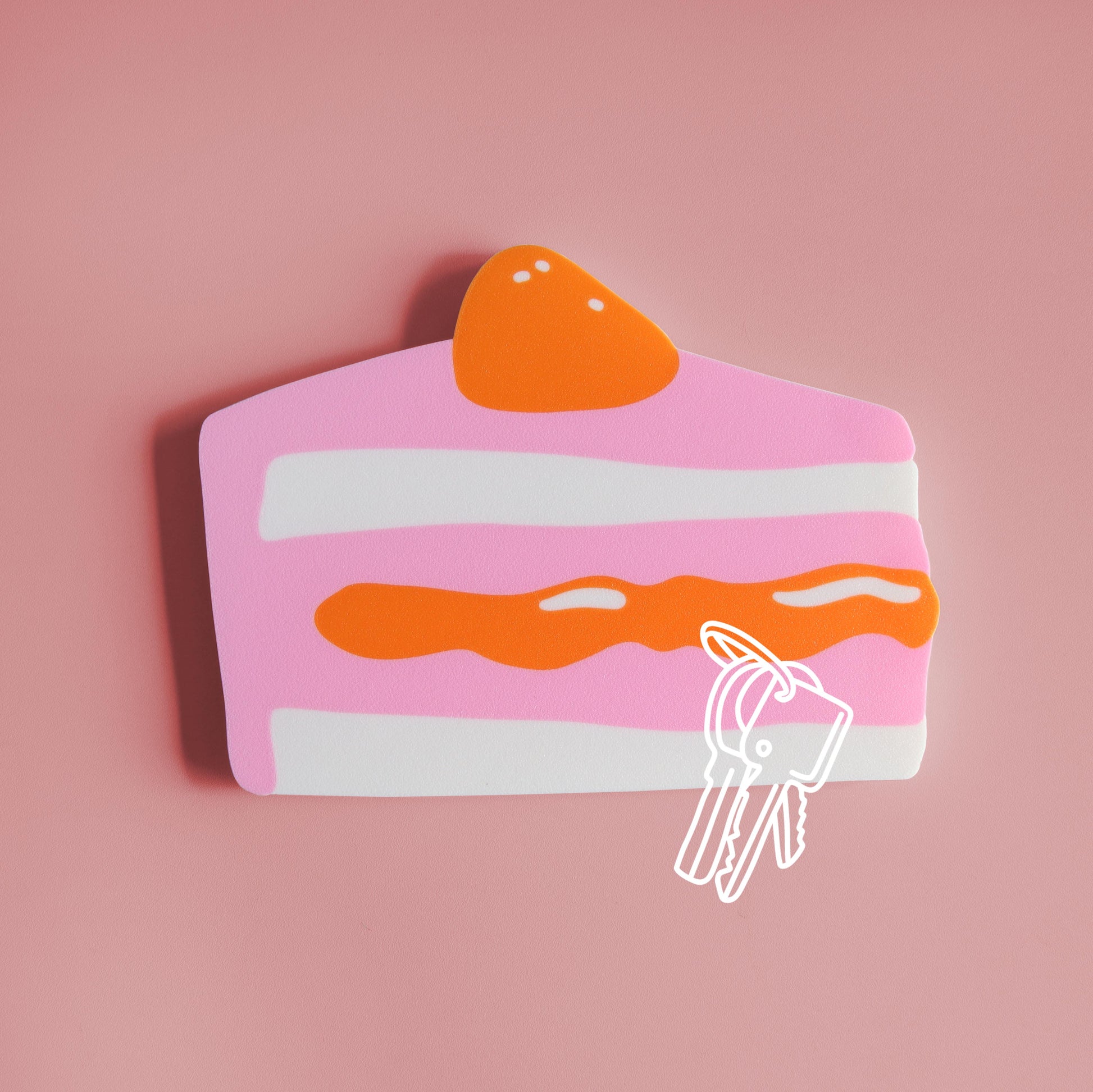 magnetic key holder in the shape of a piece of cake