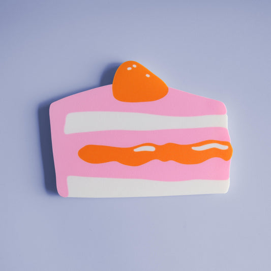 colorful wall decor in the shape of a piece of cake