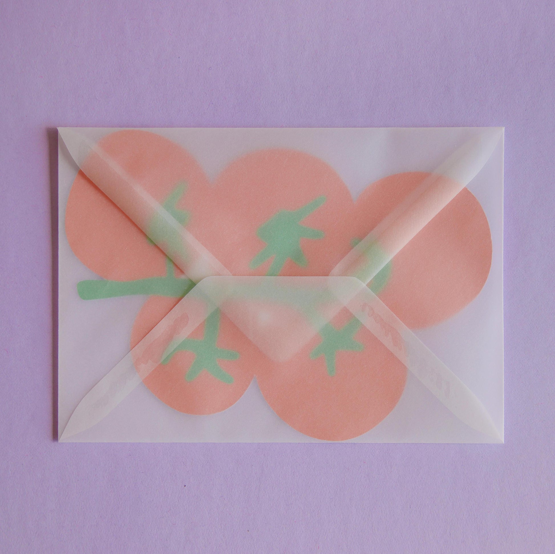 a postcard shaped like a bunch of tomatoes inside a transparent envelope